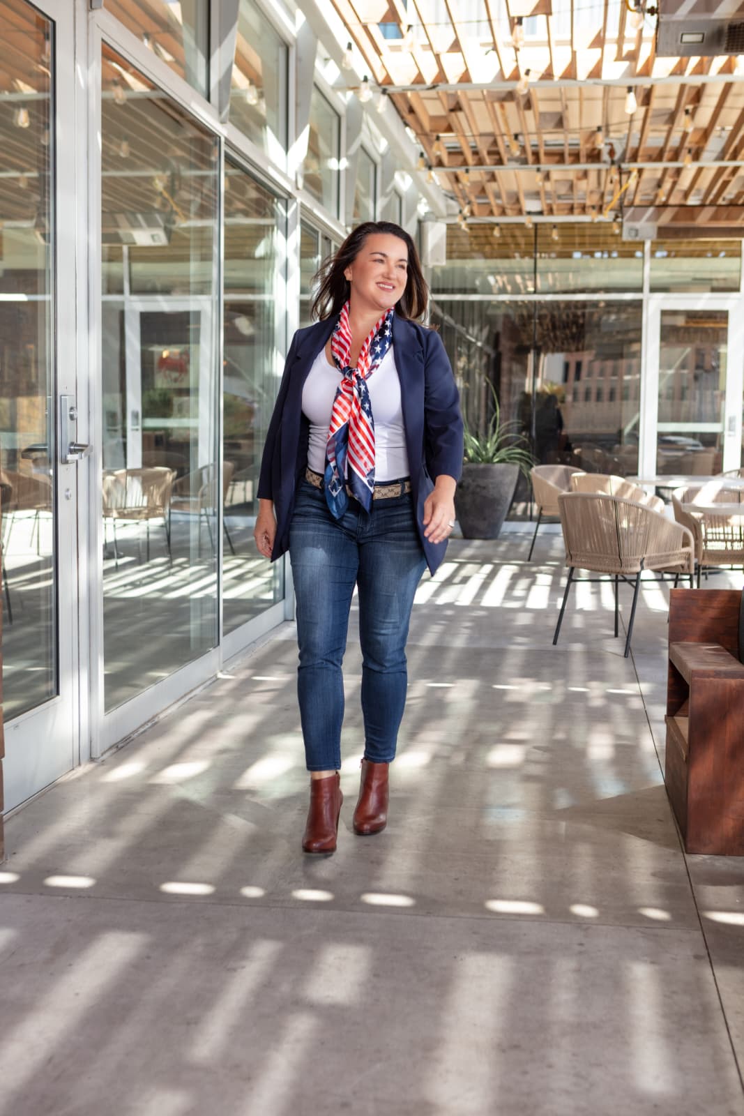 Chasity walking through a bright professional space